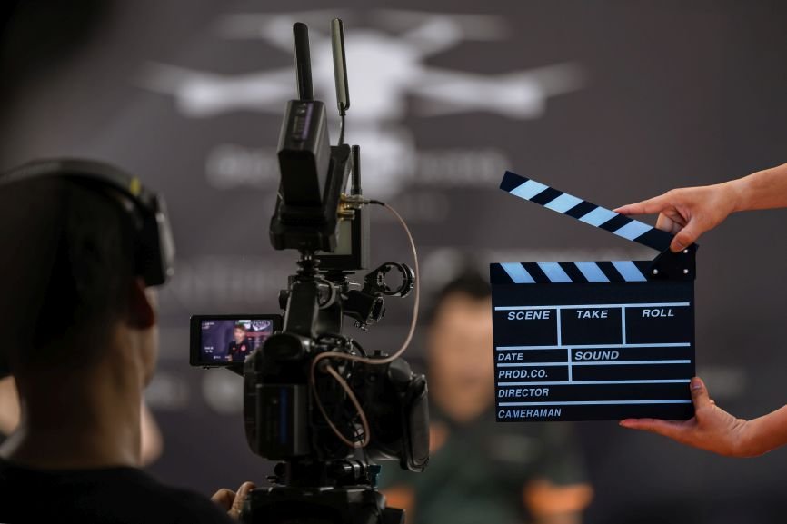 A professional film crew captures a corporate video scene with a clapperboard and camera setup, reflecting how startups in Pakistan can use strategic video production for brand storytelling, pitch content, product communication, and growth-focused marketing